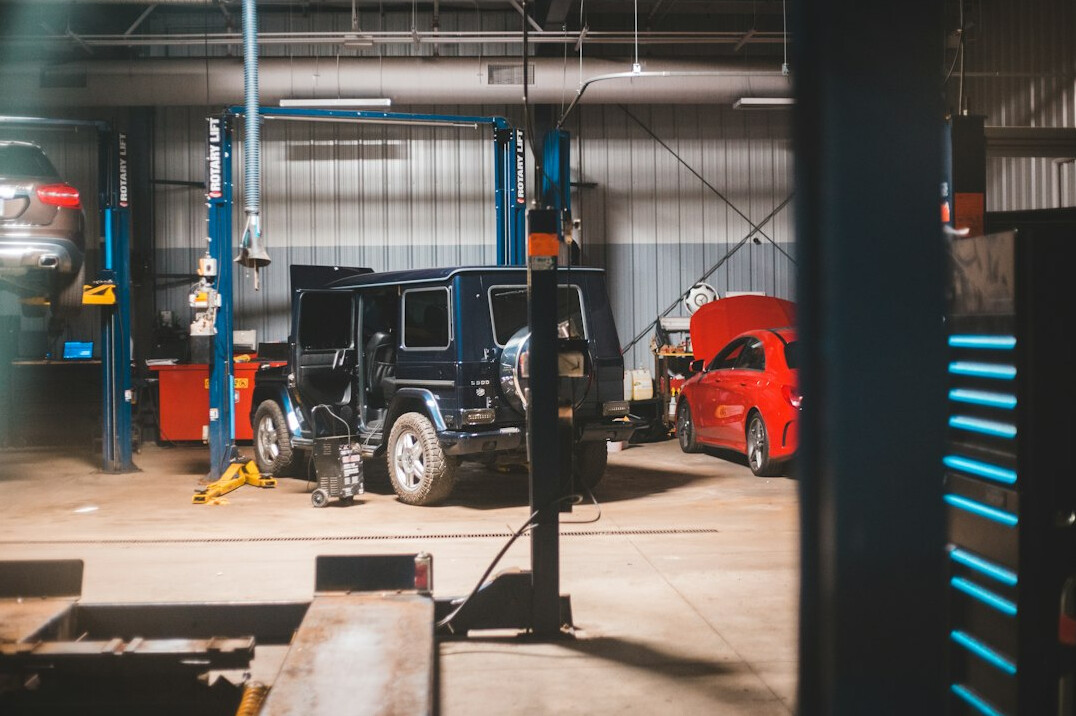 Car workshop with a vehicle on a lift